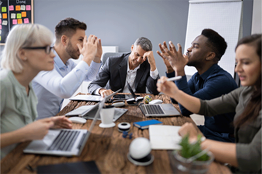 group of people in an office arguing